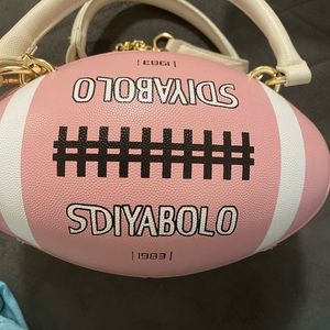 Ladies pink and white football hand bag